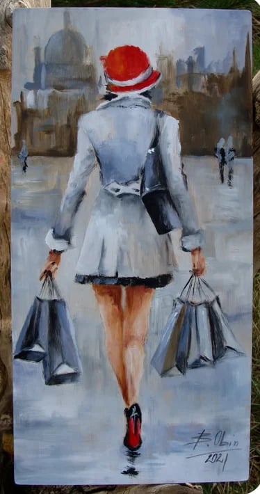 Woman in red and white hat and blue coat carrying shopping bags, walking through a city street with skyscrapers in the background