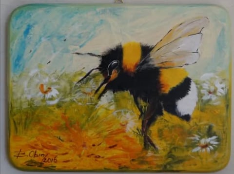 Painting of a fuzzy bumblebee with yellow and black stripes hovering over wildflowers in a meadow under blue sky