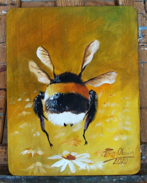 Painted artwork of a bumblebee with fuzzy body on golden yellow background hovering above white daisy flowers